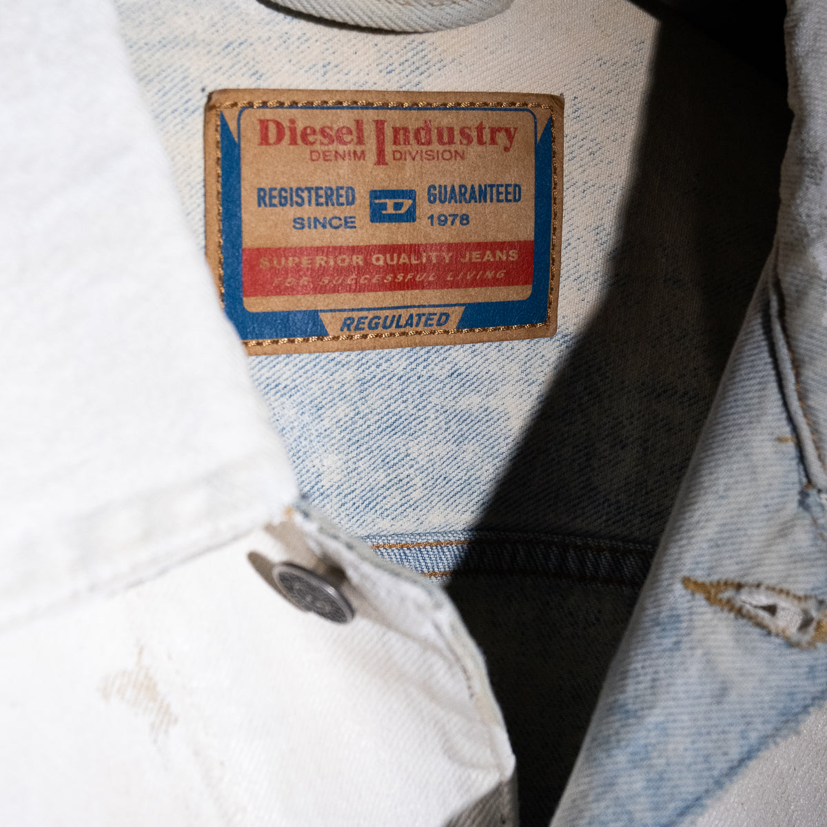 Painted cracked denim jeans