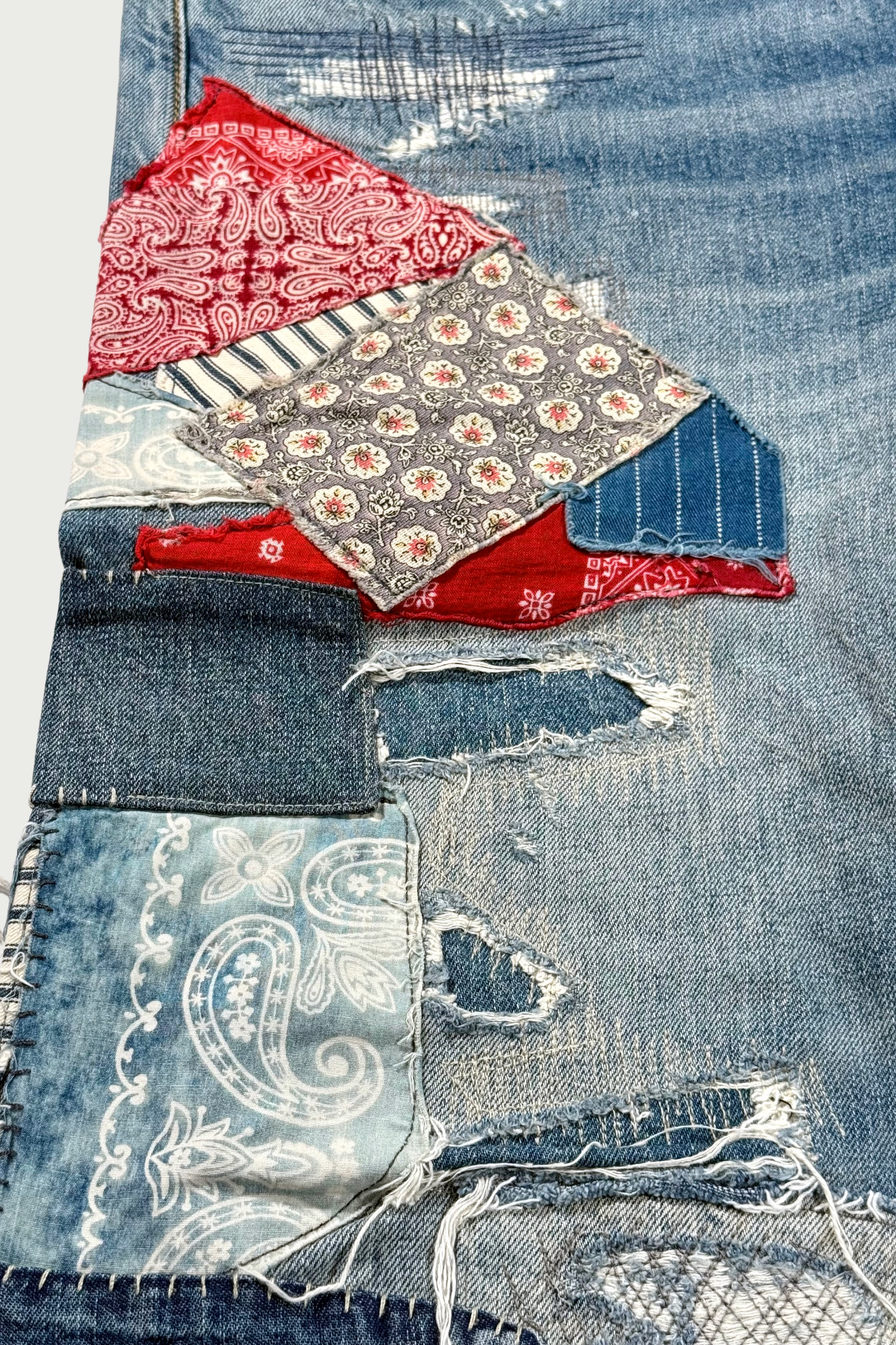 Repaired patchwork jeans
