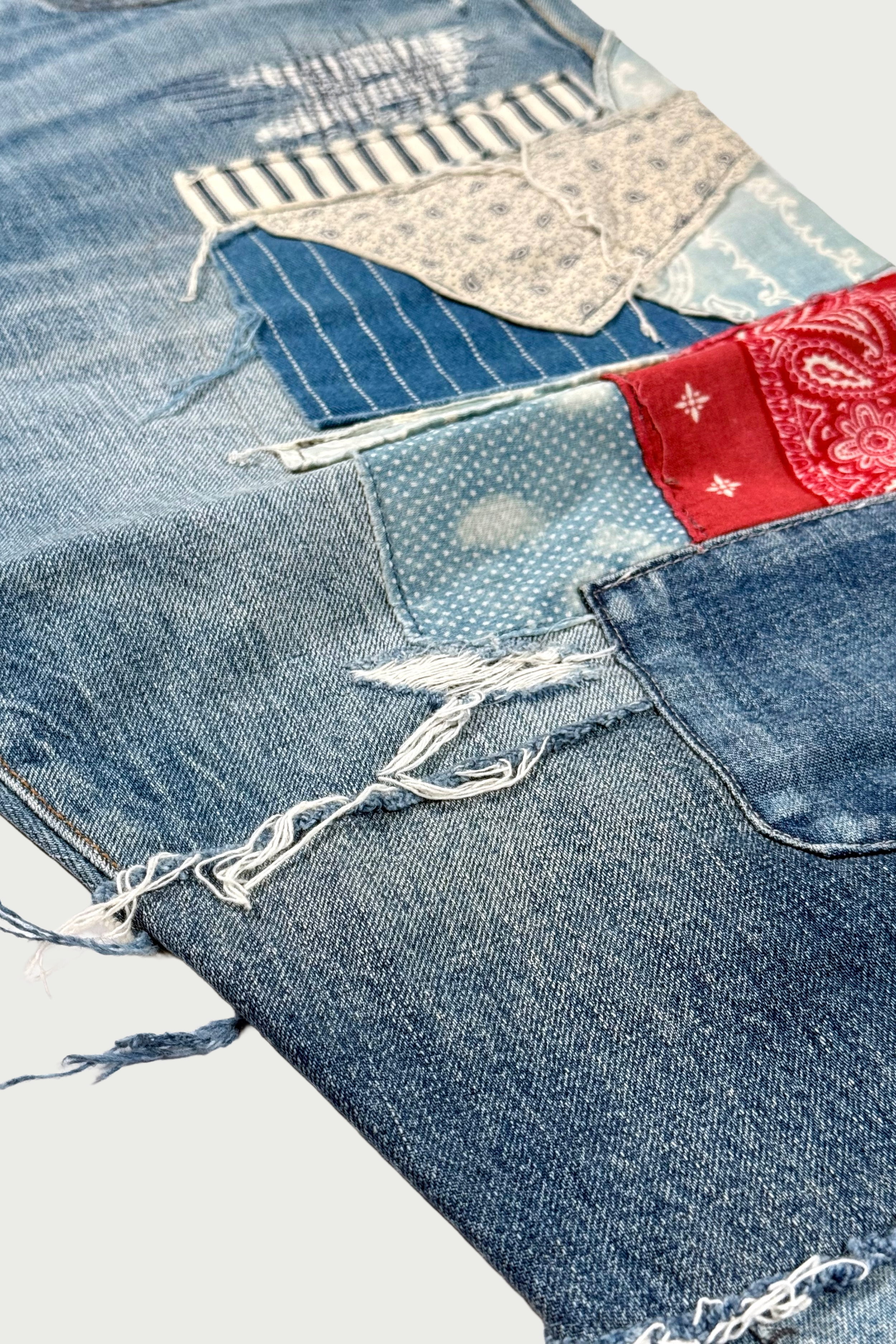 Repaired patchwork jeans