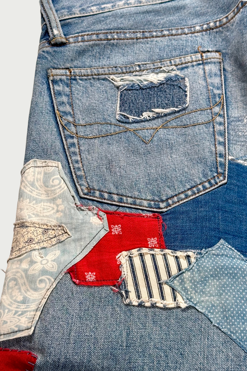 Repaired patchwork jeans